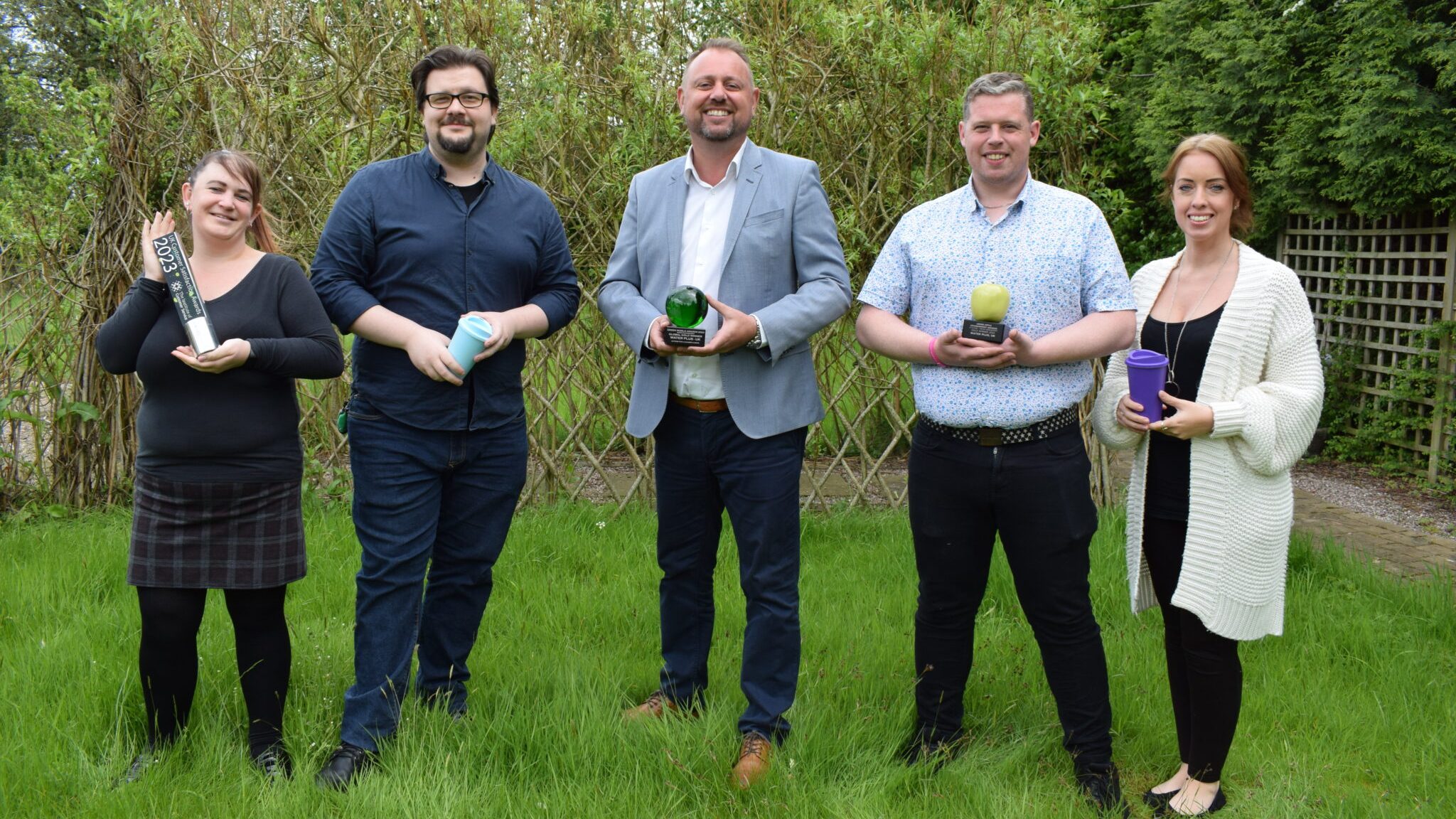 Andy Hughes, Chief Executive of Water Plus, is pictured holding the Green World Award alongside colleagues